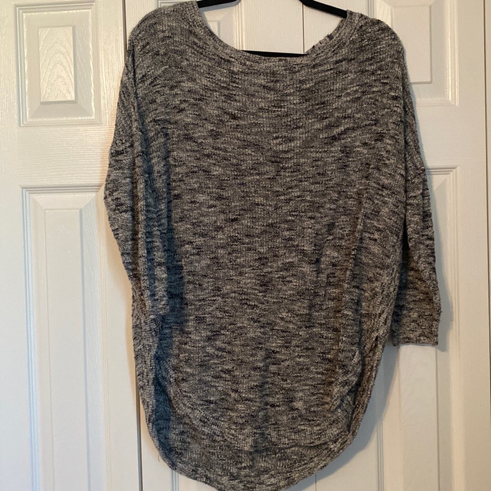 Black, white and grey sweater with cross cross cutout on back
